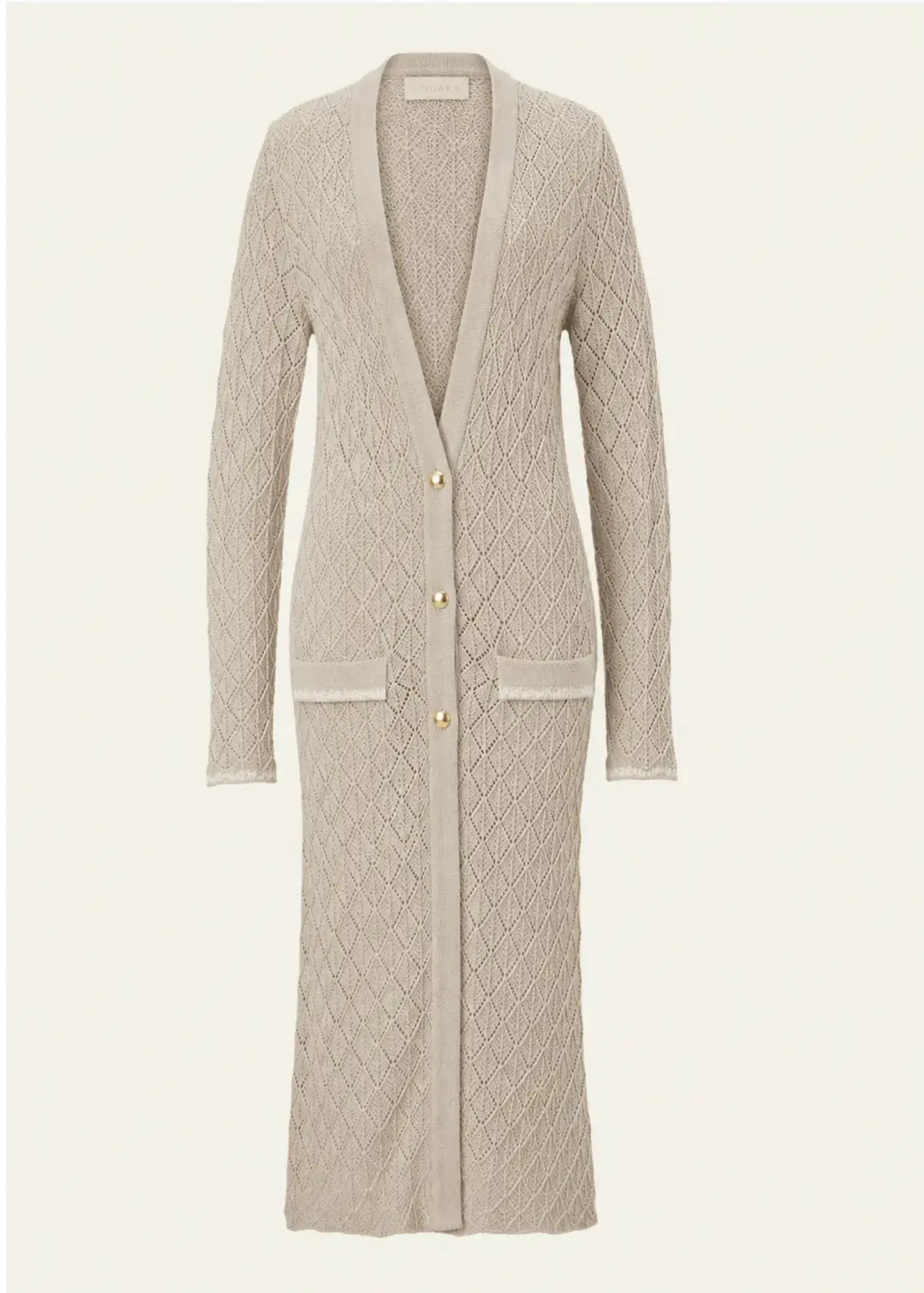 Luxury designer knitwear women by Ondara featuring a premium cotton longline cardigan with intricate geometric openwork knit, exquisite hand-embroidered pockets and matte gold buttons.