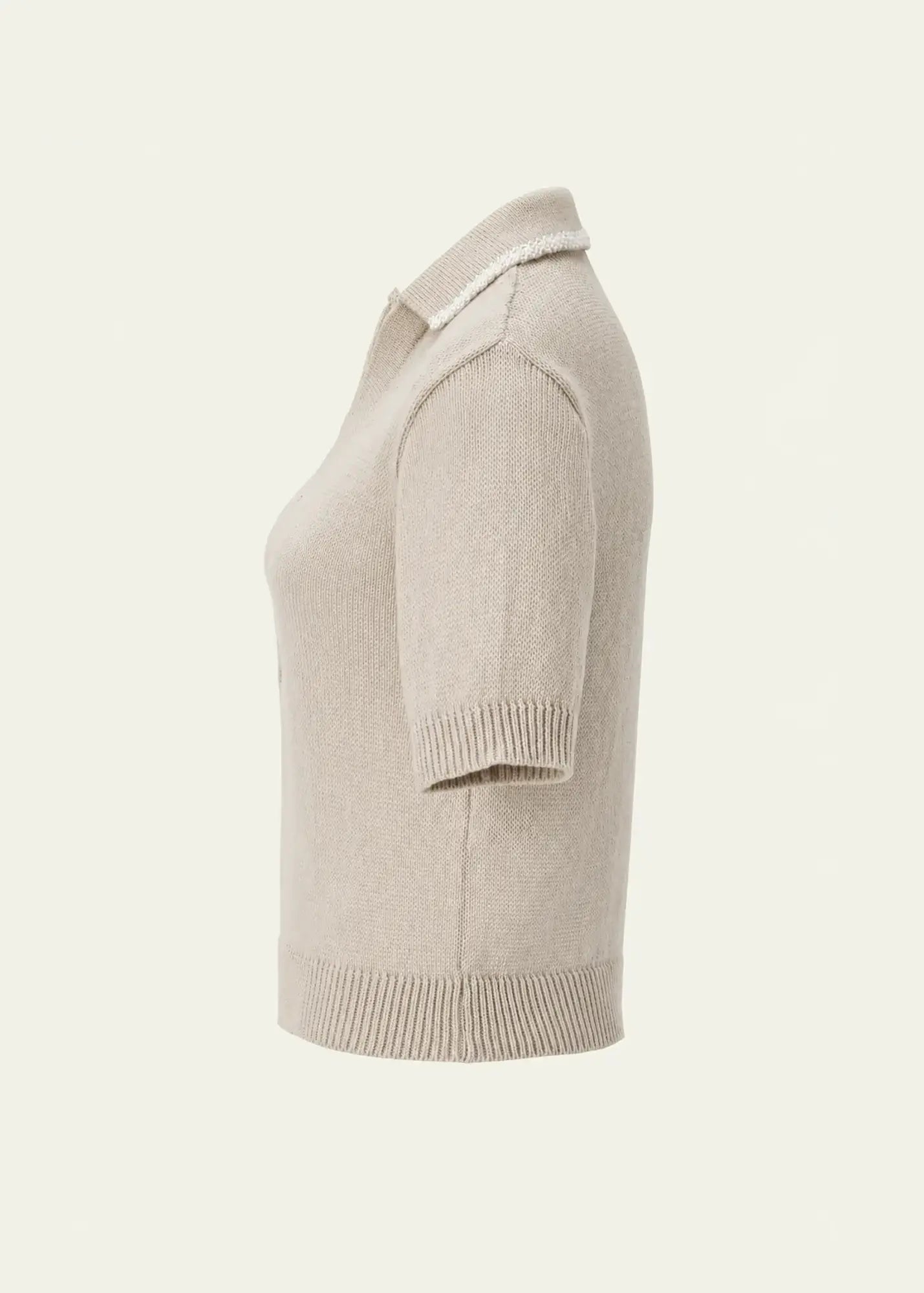 Designer women’s knit polo crafted from fine cotton with a lightweight feel, short sleeves, and a timeless neutral color palette.